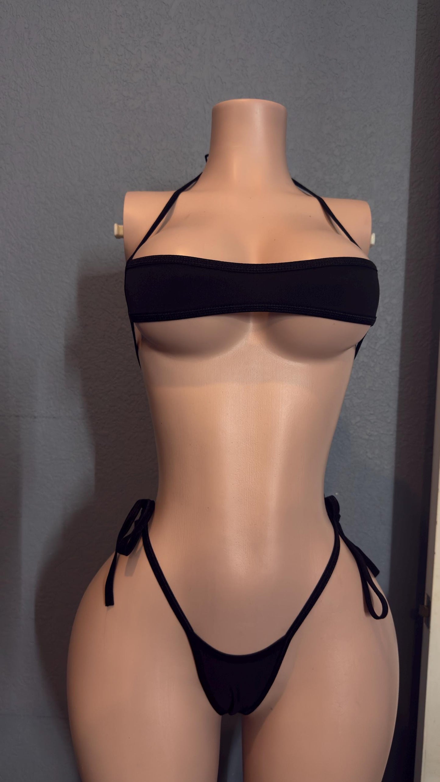 Classic black narrow bandeau stripper bikini with side ties.